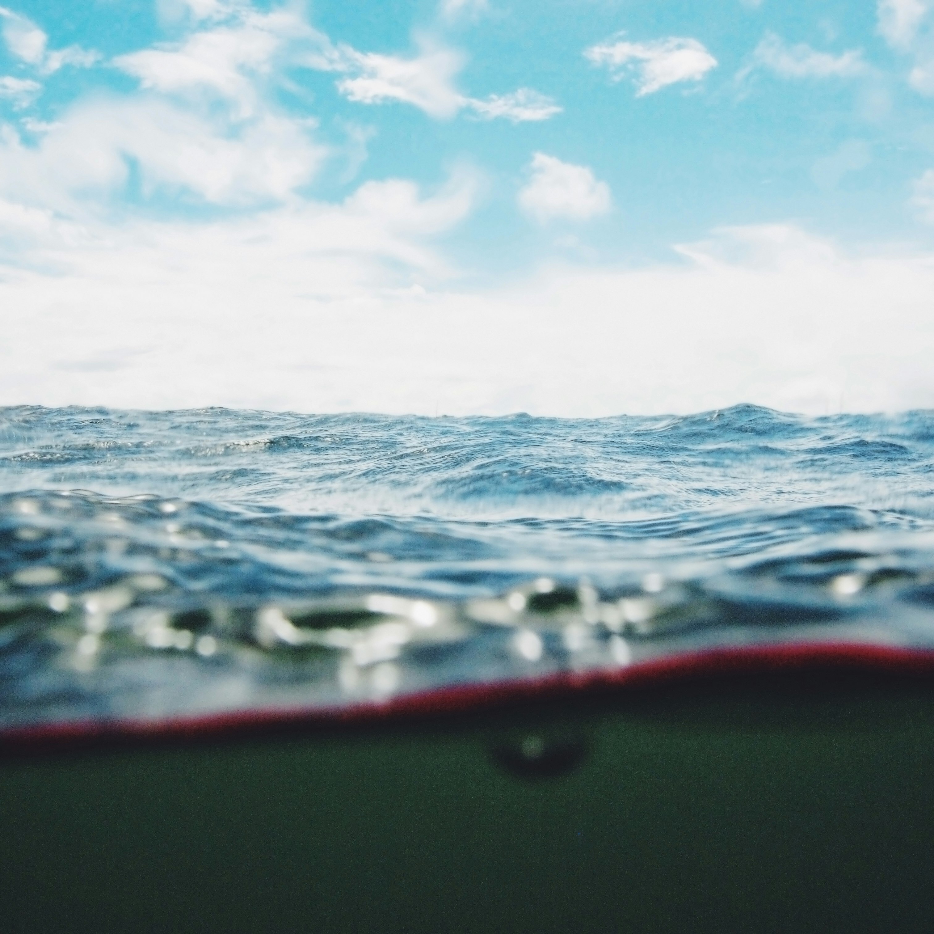 body of water under cloudy sky